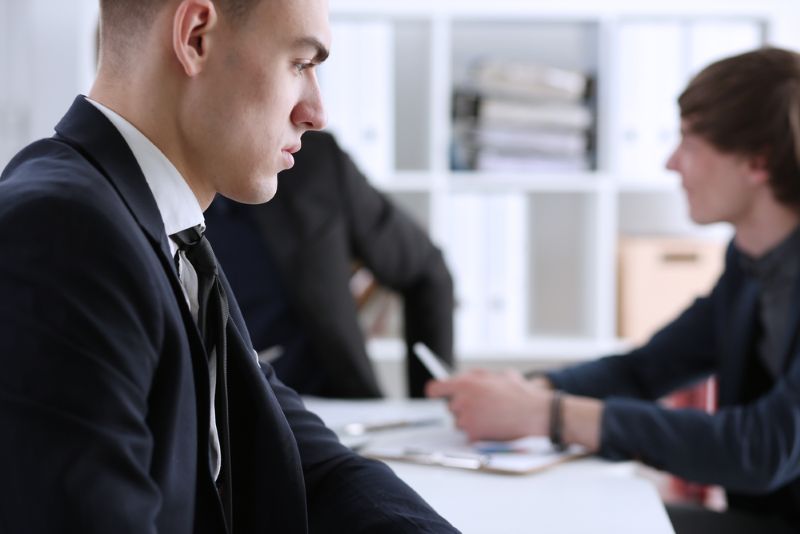 Bank employees sitting around a table together